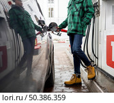 close up man with car gas station. Стоковое фото, агентство Ingram Publishing / Фотобанк Лори