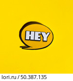 hey speech bubble yellow backdrop. Стоковое фото, агентство Ingram Publishing / Фотобанк Лори