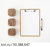 top view notepad food rations donation. Стоковое фото, агентство Ingram Publishing / Фотобанк Лори