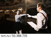 two male female mime artist rehearsing stage auditorium. Стоковое фото, агентство Ingram Publishing / Фотобанк Лори