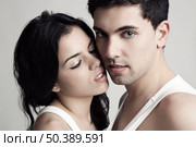 Sexy young couple isolated on a gray background. Стоковое фото, агентство Ingram Publishing / Фотобанк Лори