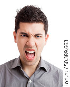 Portrait of a angry young man yelling, isolated on white background. Стоковое фото, агентство Ingram Publishing / Фотобанк Лори