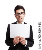 Dumb businessman holding a cardboard, isolated on white background. Стоковое фото, агентство Ingram Publishing / Фотобанк Лори