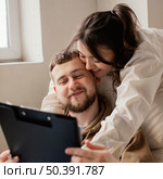 close up woman holding man. Стоковое фото, агентство Ingram Publishing / Фотобанк Лори