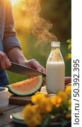 A golden hour close-up of father's calloused hands cutting melon slices near a milk bottle alfresco in open air backyard. Стоковое AI-видео, аниматор Sergey Grishin / Фотобанк Лори