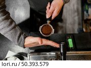 top view male barista holding professional coffee machine cup. Стоковое фото, агентство Ingram Publishing / Фотобанк Лори