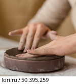 close up hands touching clay. Стоковое фото, агентство Ingram Publishing / Фотобанк Лори