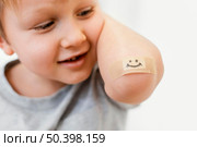 close up kid with smiley patch. Стоковое фото, агентство Ingram Publishing / Фотобанк Лори