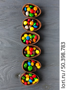 line from chocolate eggs with candies. Стоковое фото, агентство Ingram Publishing / Фотобанк Лори