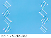 design made with cotton swabs side blue background. Стоковое фото, агентство Ingram Publishing / Фотобанк Лори