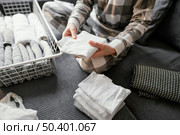 close up arranging clothes 13. Стоковое фото, агентство Ingram Publishing / Фотобанк Лори