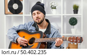 medium shot musician playing guitar. Стоковое фото, агентство Ingram Publishing / Фотобанк Лори