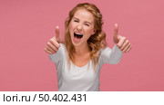 portrait female laughs shows ok sign. Стоковое фото, агентство Ingram Publishing / Фотобанк Лори