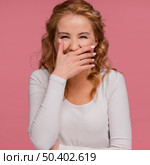 portrait woman laughing covers her mouth. Стоковое фото, агентство Ingram Publishing / Фотобанк Лори