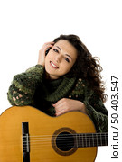 Beautiful woman isolated on white playing music with a guitar. Стоковое фото, агентство Ingram Publishing / Фотобанк Лори