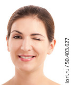 Portrait of a beautiful young woman winking, isolated on white. Стоковое фото, агентство Ingram Publishing / Фотобанк Лори