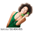 Afro-American young woman answering a call, isolated on white background. Стоковое фото, агентство Ingram Publishing / Фотобанк Лори