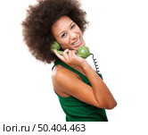 Afro-American young woman answering a call, isolated on white background. Стоковое фото, агентство Ingram Publishing / Фотобанк Лори
