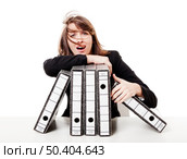 Exhausted woman in the office full of folders and work to do, isolated on white background. Стоковое фото, агентство Ingram Publishing / Фотобанк Лори
