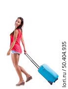 Happy woman going on vacation and walking with a suitcase. Стоковое фото, агентство Ingram Publishing / Фотобанк Лори