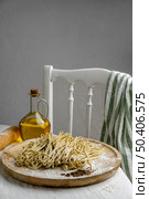 high angle fresh noodles wooden board. Стоковое фото, агентство Ingram Publishing / Фотобанк Лори