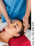 high angle male osteopathic therapist checking female patient s neck spine. Стоковое фото, агентство Ingram Publishing / Фотобанк Лори