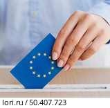 OLYMPUS DIGITAL CAMERA. woman putting european ballot box close up. Стоковое фото, агентство Ingram Publishing / Фотобанк Лори