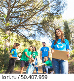youth cleaning forest from trash. Стоковое фото, агентство Ingram Publishing / Фотобанк Лори