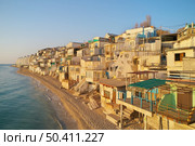 Old damage houses on the sea shore. Building and nature. Стоковое фото, агентство Ingram Publishing / Фотобанк Лори