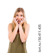 Beautiful blonde woman with a fear expression, isolated over white background. Стоковое фото, агентство Ingram Publishing / Фотобанк Лори