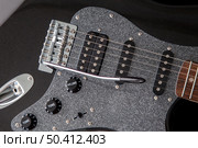 soundboard of an electric guitar close-up. shape of stratocaster, humbucker and 2 singles. Стоковое фото, агентство Ingram Publishing / Фотобанк Лори