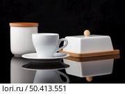 a set of porcelain and wooden utensils, on a black background. Стоковое фото, агентство Ingram Publishing / Фотобанк Лори