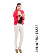 Business woman texting someone, isolated over a white background. Стоковое фото, агентство Ingram Publishing / Фотобанк Лори