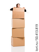 Happy business woman appear inside big card boxes, isolated over white background. Стоковое фото, агентство Ingram Publishing / Фотобанк Лори