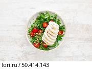 Salad with arugula, mozzarella cheese and pine nuts, top view. Стоковое фото, агентство Ingram Publishing / Фотобанк Лори