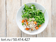 Barley porridge with green peas, baked pumpkin and fresh arugula salad. Стоковое фото, агентство Ingram Publishing / Фотобанк Лори