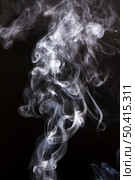 wispy smoke clouds spread black background. Стоковое фото, агентство Ingram Publishing / Фотобанк Лори