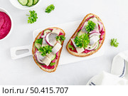 Sandwiches, toasts with salted herring and beetroot pate, top view. Стоковое фото, агентство Ingram Publishing / Фотобанк Лори