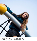 low angle young girl having fun playground. Стоковое фото, агентство Ingram Publishing / Фотобанк Лори