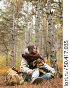 young woman spending time together with her dog outside. Стоковое фото, агентство Ingram Publishing / Фотобанк Лори