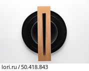 flat lay dark dinnerware with chopsticks 2. Стоковое фото, агентство Ingram Publishing / Фотобанк Лори