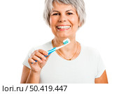 Portrait of a happy old woman brushing her teeth. Стоковое фото, агентство Ingram Publishing / Фотобанк Лори