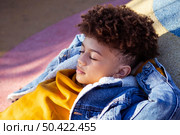 sideways little boy relaxing playground. Стоковое фото, агентство Ingram Publishing / Фотобанк Лори
