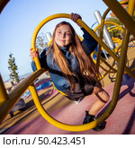 cute little girl having fun playground outdoors. Стоковое фото, агентство Ingram Publishing / Фотобанк Лори