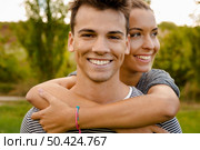 Portrait of a happy young couple embraced together. Стоковое фото, агентство Ingram Publishing / Фотобанк Лори