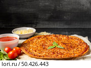 high angle cheese pizza with tomato sauce mozzarella basil. Стоковое фото, агентство Ingram Publishing / Фотобанк Лори