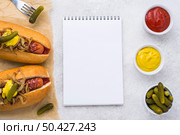 top view hot dogs with mustard pickles. Стоковое фото, агентство Ingram Publishing / Фотобанк Лори