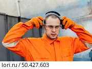 worker uniform with headphones protective glasses. Стоковое фото, агентство Ingram Publishing / Фотобанк Лори