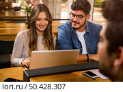 Friends studying together for the upcoming exams. Стоковое фото, агентство Ingram Publishing / Фотобанк Лори