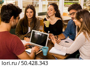 Group of friends studying together for finals. Стоковое фото, агентство Ingram Publishing / Фотобанк Лори